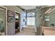 Bathroom with separate shower and jacuzzi-style tub at 5776 Falling Tree Ln, Port Orange, FL 32127