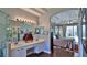 Bathroom with double vanity, walk-in shower, and access to main bedroom at 5776 Falling Tree Ln, Port Orange, FL 32127