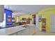 Spacious kitchen featuring modern appliances, a breakfast bar, and an open floor plan at 5776 Falling Tree Ln, Port Orange, FL 32127