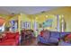 Cozy living room featuring hard wood floors, open floor plan and comfortable seating at 5776 Falling Tree Ln, Port Orange, FL 32127
