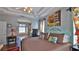 Spacious main bedroom with view of bathroom and comfortable furniture at 5776 Falling Tree Ln, Port Orange, FL 32127