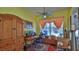 Inviting home office with natural light, wooden desk, and serene views of the backyard pool at 5776 Falling Tree Ln, Port Orange, FL 32127