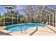 Enjoy a spacious screened in pool area with spa and plenty of sunshine and nature at 5776 Falling Tree Ln, Port Orange, FL 32127