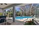 Enjoy the screened-in pool with a spa tub, and relaxing outdoor area at 5776 Falling Tree Ln, Port Orange, FL 32127