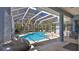 Relaxing screened-in pool with lush landscaping, hot tub, and plenty of space for outdoor entertaining at 5776 Falling Tree Ln, Port Orange, FL 32127