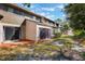 Townhouse backyard with sliding glass doors and a green space perfect for relaxing outdoors at 643 Woodridge Dr, Fern Park, FL 32730