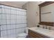 Well-lit bathroom with a shower-tub combo and a vanity at 643 Woodridge Dr, Fern Park, FL 32730