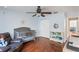 Spacious Bedroom featuring hardwood floors, ceiling fan, crib, and rocking chair at 643 Woodridge Dr, Fern Park, FL 32730