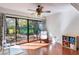 Bedroom with sliding glass doors to backyard and ceiling fan at 643 Woodridge Dr, Fern Park, FL 32730