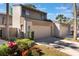 Beautiful exterior of a two-story townhouse with a garage and lush landscaping on a sunny day at 643 Woodridge Dr, Fern Park, FL 32730