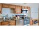Well-appointed kitchen with stainless steel appliances, granite countertops, and a stylish subway tile backsplash at 643 Woodridge Dr, Fern Park, FL 32730