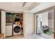 Laundry room with modern washer and dryer and outdoor access at 643 Woodridge Dr, Fern Park, FL 32730