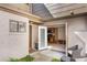 Outdoor patio with seating area and view into the kitchen at 643 Woodridge Dr, Fern Park, FL 32730