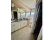 Bathroom featuring double sinks, granite countertops, and a glass-enclosed shower at 7112 Enchanted Lake Dr, Winter Garden, FL 34787