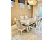 Open dining room featuring an elegant light fixture and neutral decor at 7112 Enchanted Lake Dr, Winter Garden, FL 34787