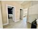 Bright hallway with wood-look flooring and doors leading to various rooms at 7112 Enchanted Lake Dr, Winter Garden, FL 34787