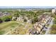 An aerial view shows the townhome's location near the green golf course and beautiful landscaping at 7512 Seven Eagles Way # 7512, Reunion, FL 34747