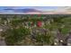 Aerial view of a resort community showing well-manicured grounds, yellow townhomes, and a golf course under a dramatic sky at 7512 Seven Eagles Way # 7512, Reunion, FL 34747