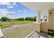 Relaxing view from the balcony overlooking a lush golf course with a tranquil landscape at 7512 Seven Eagles Way # 7512, Reunion, FL 34747