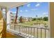 Inviting balcony offers scenic views of the golf course and the community's yellow residential buildings at 7512 Seven Eagles Way # 7512, Reunion, FL 34747