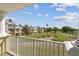 Scenic view from the balcony overlooking the lush green golf course and beautifully maintained homes at 7512 Seven Eagles Way # 7512, Reunion, FL 34747