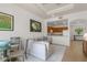 Inviting living room with a comfortable couch and a seamless transition into the kitchen and dining area at 7512 Seven Eagles Way # 7512, Reunion, FL 34747