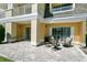 Patio with outdoor seating and a view of the building's exterior at 7512 Seven Eagles Way # 7512, Reunion, FL 34747