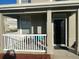 Inviting front porch featuring seating area and black front door at 8989 Lee Vista Blvd # 2106, Orlando, FL 32829
