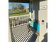 Cozy front porch seating area with views of the pond at 8989 Lee Vista Blvd # 2106, Orlando, FL 32829