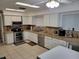 Spacious kitchen with stainless steel appliances, granite countertops, and plenty of cabinet space at 932 Pelican Bay Dr, Daytona Beach, FL 32119