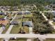 Aerial view of home showing large yard surrounded by neighborhood homes and natural landscape at 1139 9Th Ave, Deland, FL 32724