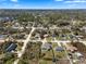 An aerial shot showcases a tranquil neighborhood blending seamlessly into the verdant landscape at 1139 9Th Ave, Deland, FL 32724