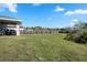 Spacious backyard with a wood fence, offering privacy and plenty of room for outdoor activities at 1139 9Th Ave, Deland, FL 32724