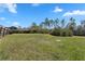 Large grassy backyard enclosed by a wood fence, providing a secure and private outdoor space at 1139 9Th Ave, Deland, FL 32724