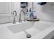 Bathroom sink featuring modern fixtures, a decorative mirror, and stylish countertop accessories at 1139 9Th Ave, Deland, FL 32724