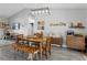 Bright dining room with wood table, bench seating, and stylish mid-century modern accents at 1139 9Th Ave, Deland, FL 32724