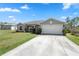 Attractive single-story home with a well-kept lawn and a two-car garage at 1139 9Th Ave, Deland, FL 32724