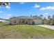 Attractive single-story home featuring a manicured lawn, two-car garage, and welcoming front door at 1139 9Th Ave, Deland, FL 32724