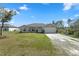 Well-maintained single-story home with a green lawn, two-car garage, and inviting front entrance at 1139 9Th Ave, Deland, FL 32724