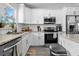 Bright kitchen with white subway tile backsplash, stainless steel appliances, and granite countertops at 1139 9Th Ave, Deland, FL 32724