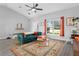 Comfortable living room featuring a stylish rug, a cozy sofa, and bright natural light at 1139 9Th Ave, Deland, FL 32724