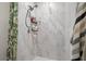 Modern tiled shower with marble-look walls, a handheld shower head, and a decorative shower curtain at 1139 9Th Ave, Deland, FL 32724