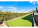 Well-manicured backyard bocce ball court offering a recreational amenity at 1148 Grand Traverse Pkwy, Reunion, FL 34747
