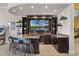 Home bar featuring bar seating and TV at 1148 Grand Traverse Pkwy, Reunion, FL 34747