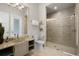 Modern bathroom with glass bowl sink, granite countertop, walk-in shower, and neutral color palette at 1148 Grand Traverse Pkwy, Reunion, FL 34747