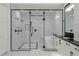 Bright bathroom featuring walk-in shower and soaking tub with dark fixtures and white subway tile at 1148 Grand Traverse Pkwy, Reunion, FL 34747