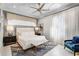 Bright bedroom featuring a bed with plush bedding and patterned rug, and seating at 1148 Grand Traverse Pkwy, Reunion, FL 34747