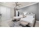Bedroom with two twin beds, grey walls, a rug, and white trim at 1148 Grand Traverse Pkwy, Reunion, FL 34747