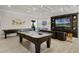 Enjoy a spacious game room with billiards, shuffleboard, air hockey, and comfortable seating for gatherings at 1148 Grand Traverse Pkwy, Reunion, FL 34747