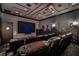 Modern home theater with comfortable leather recliners and a large screen for immersive viewing at 1148 Grand Traverse Pkwy, Reunion, FL 34747